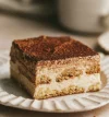 attachment-https://c.roti-dintate.ro/wp-content/uploads/2025/02/tiramisu-100x107.webp